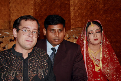 Dustin with the Bride and Groom