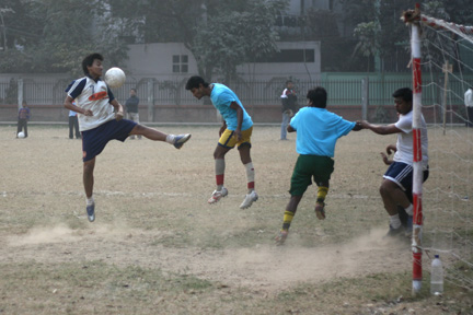 A hard fought game! A head shot moves he ball back.