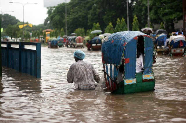 Trying to get this lady to the sidewalk, so it's only knee-deep instead of waist-deep.