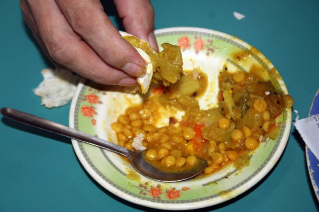 Who needs a spoon when you can grab the food with a piece of ruti!