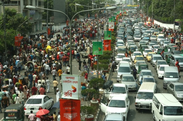 Street full of either vehicles or pedestrians!