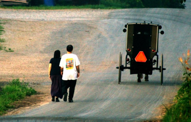 Amish carriage passes Alice and Dustin.