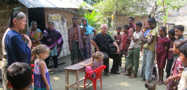 Alice and Marland in village.