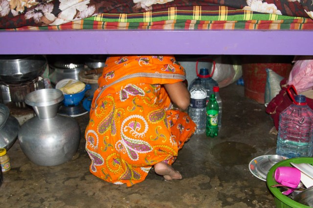 Hunting for a kitchen item under the bed.