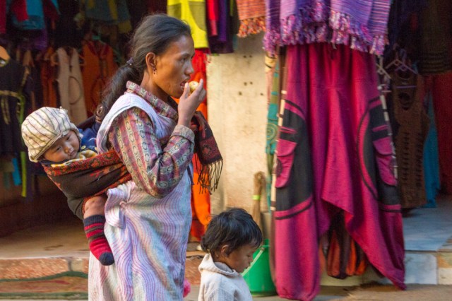 She has an apple and two children!