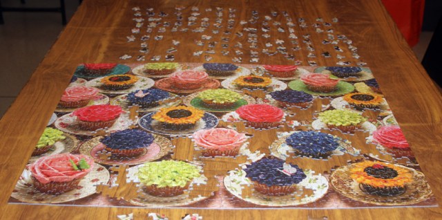 After 7 hours with 5-7 people working on this 1,000 piece puzzle!.