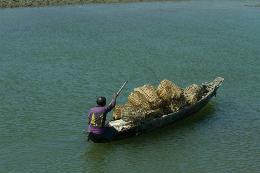 Fisherman, his boat, and traps!
