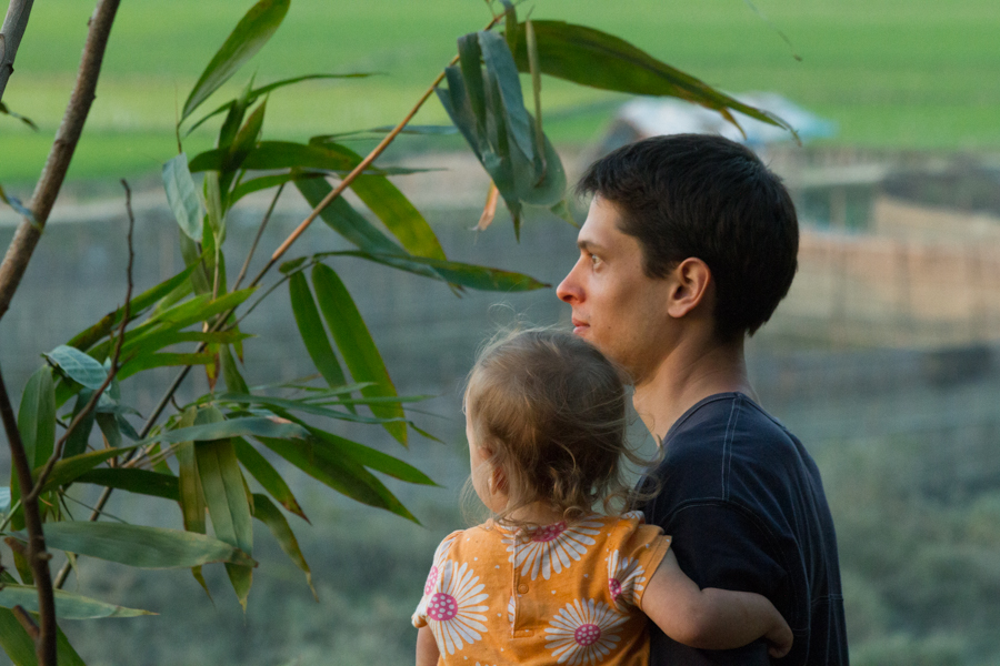 Father and daughter looking into the distance.