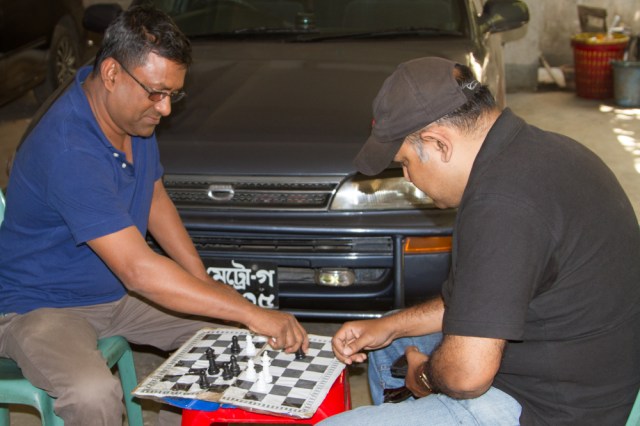 The man on the left has win the last 3 games but thinks he may lose this one!