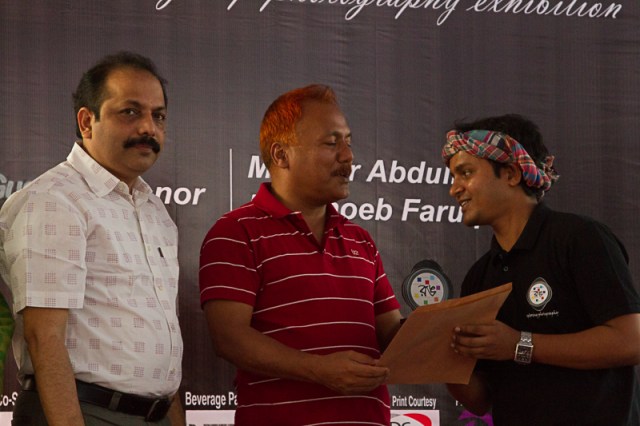 Guest of Honor, Shoeb Faruquee handing out an award.