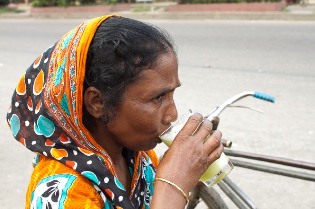 Enjoying a Refreshing Sugar Cane Drink