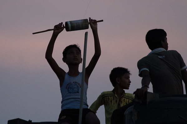 Kite Flyer on Rooftop in Early Evening. 