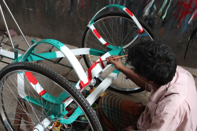 Artist at Work Painting a New Rickshaw